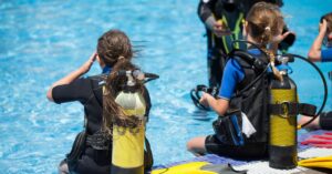 Image of kids in a swimming pool with BCD