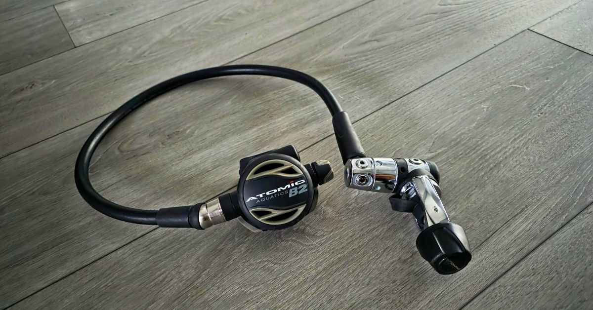 Image of Atomic Aquatics B2 1st stage regulator and 2nd stage regulator showing wear from years of use. For article titled Atomic Aquatics B2 Review.