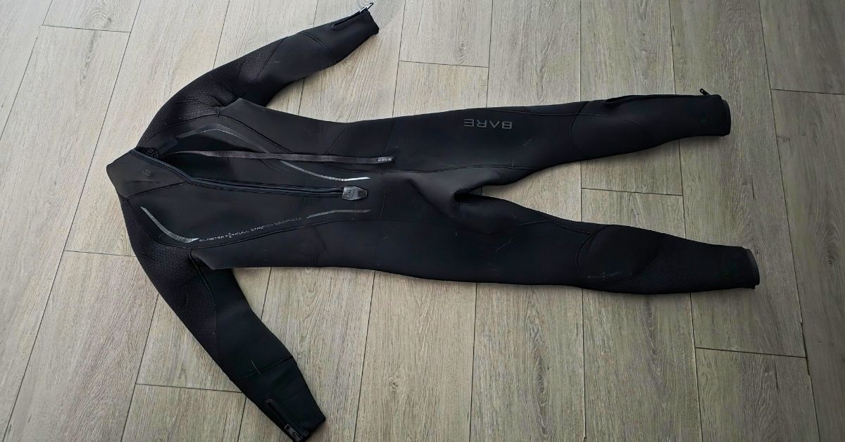 Rear of BARE Reactive 5mm wetsuit showing wear from dozens of uses. For article titled BARE Reactive 5mm Wetsuit Review.