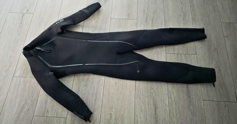 Front of BARE Reactive 5mm wetsuit showing wear from dozens of uses. For article titled BARE Reactive 5mm Wetsuit Review.