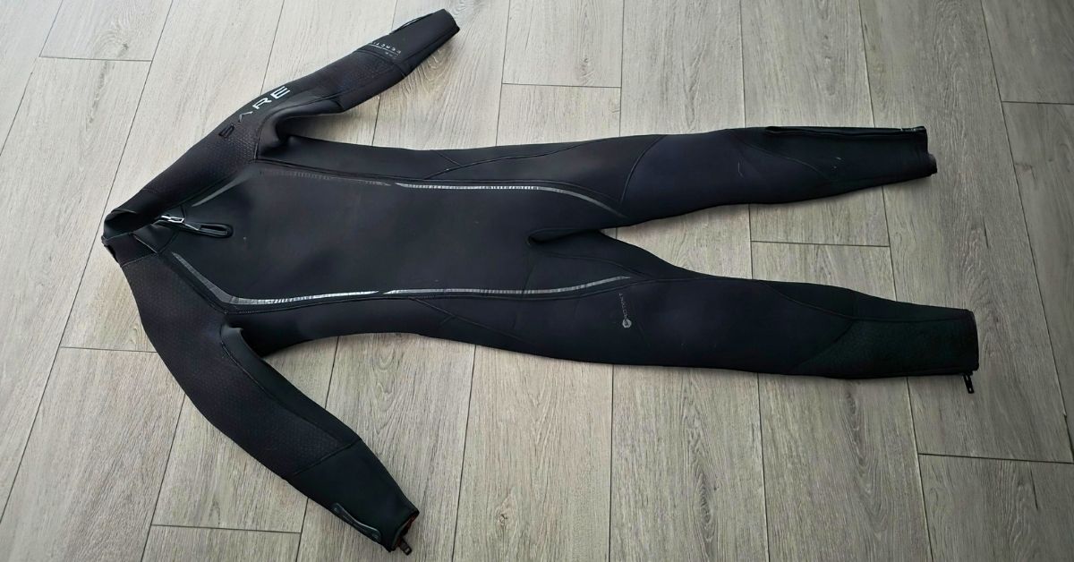 Front of BARE Reactive 5mm wetsuit showing wear from dozens of uses. For article titled BARE Reactive 5mm Wetsuit Review.