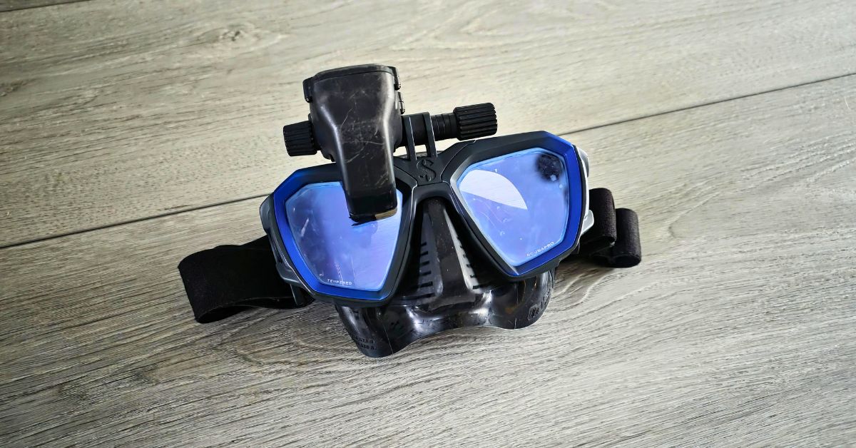 Close up of SCUBAPRO D-Mask showing wear from years of use. Equipped with SCUBAPRO Galileo HUD in the down position. For article titled SCUBAPRO D-Mask Review