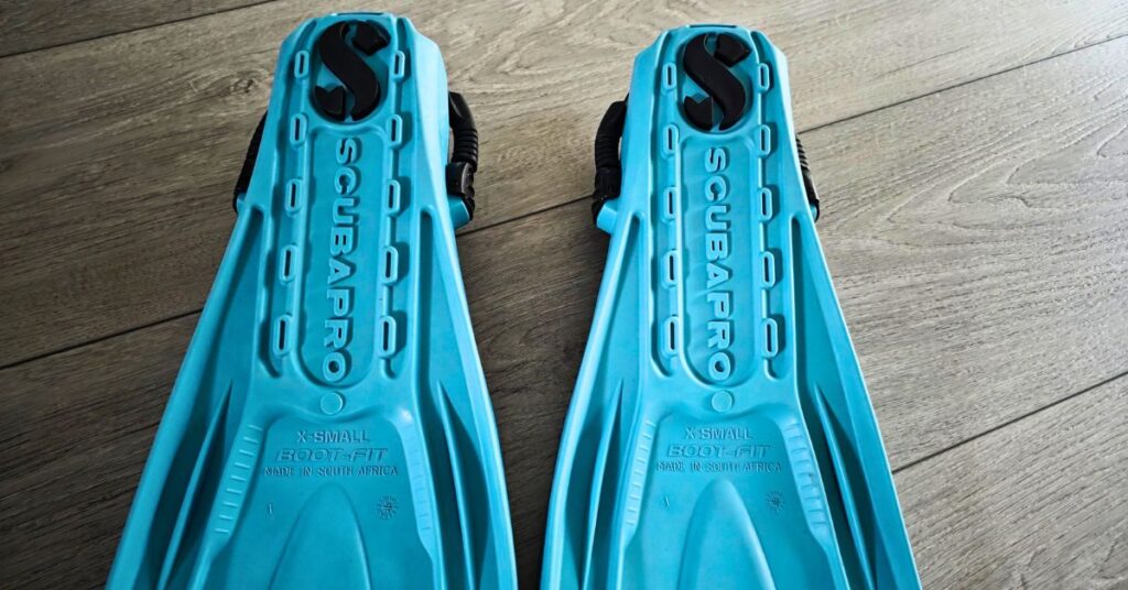 Close up of the bottom of SCUBAPRO GO Sport fins side by side with visible wear from years of use. For article titled SCUBAPRO GO Sport Review