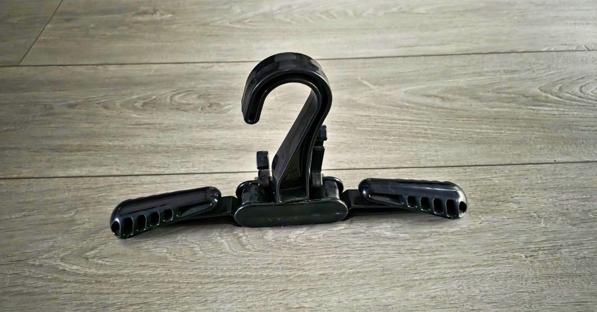 Image of XS Scuba Travel Wetsuit Hanger with accessories hangers in closed position showing wear from years of use. For article titled XS Scuba Travel Wetsuit Hanger Review.