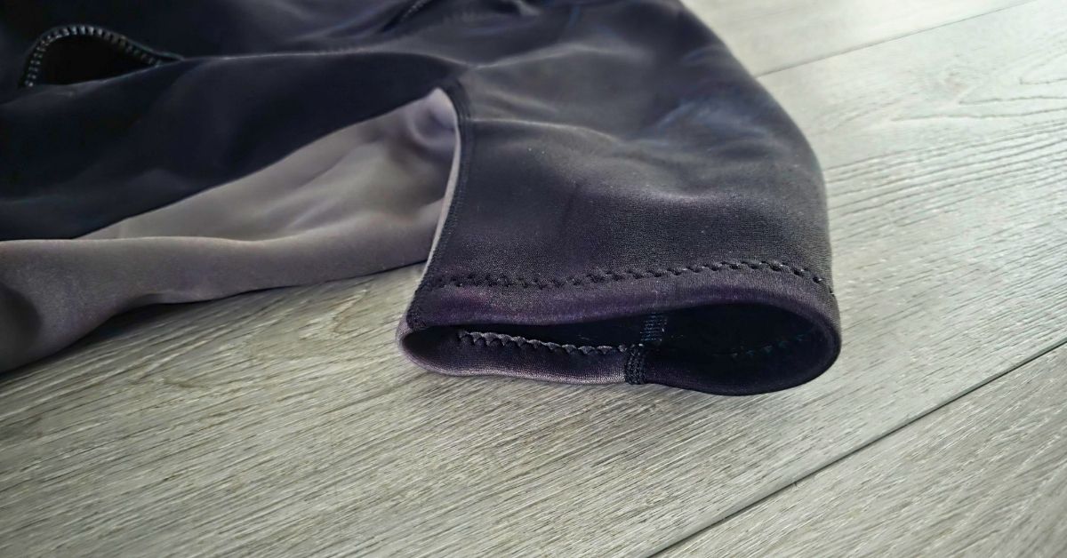 Close up of GoldFin 2mm wetsuit top arm seal showing wear from use. For article titled GoldFin 2mm Wetsuit Top & Wetsuit Shorts Review.