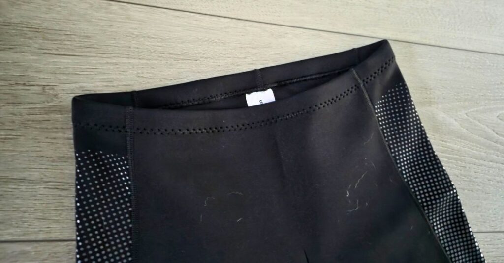 Close up of GoldFin 2mm wetsuit shorts waistband showing wear from use. For article titled GoldFin 2mm Wetsuit Top & Wetsuit Shorts Review.