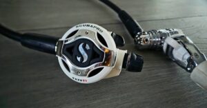 Close up of SCUBAPRO MK25 EVO/S620 Ti logo showing wear from years of use. For article titled SCUBAPRO MK25 EVO/S620 Ti Review.