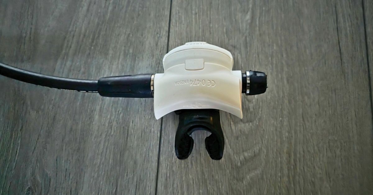 Bottom of SCUBAPRO MK25 EVO/S620 Ti 2nd stage regulator showing wear from years of use. For article titled SCUBAPRO MK25 EVO/S620 Ti Review.